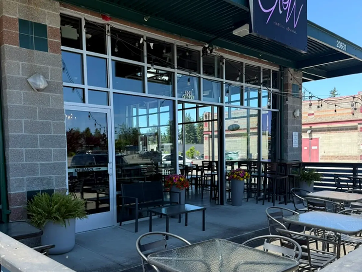 Exterior patio seating and entrance at Glow Martini Lounge